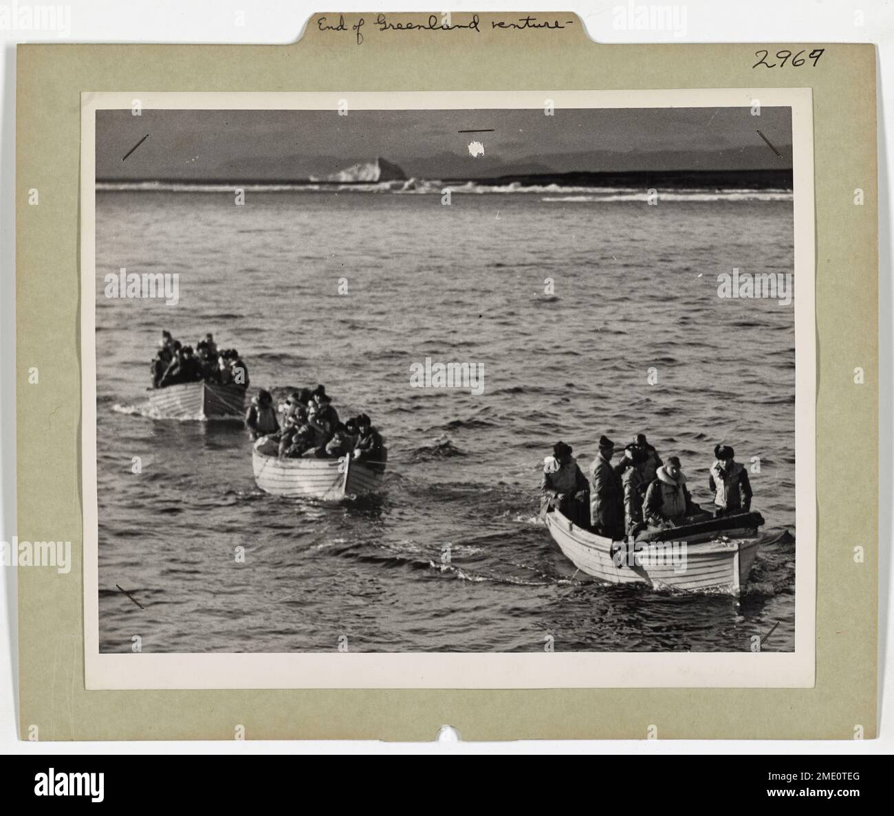 End Of A Greenland Adventure - 28 Nazi Captured by Coast Guard. This image depicts a the capture of a German expedition to establish a radio-weather station in Greenland; 28 Nazis surrendered to the Coast Guard cutter. Stock Photo
