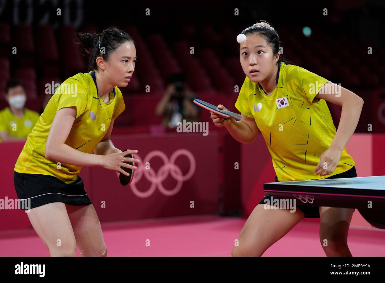 South Korea's Shin Yubin, left, and Choi Hyojoo competes during table