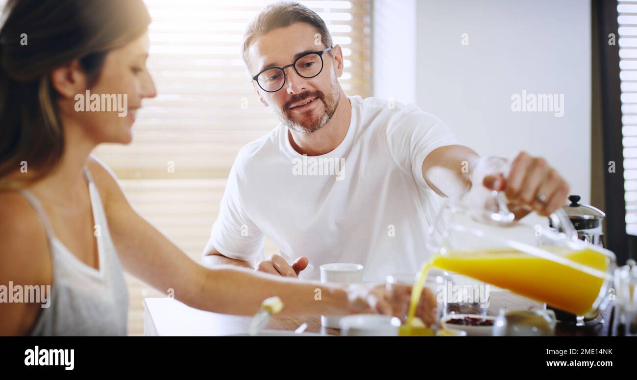 Starting the day with love and a hearty meal. a mature couple having breakfast together at home. Stock Photo