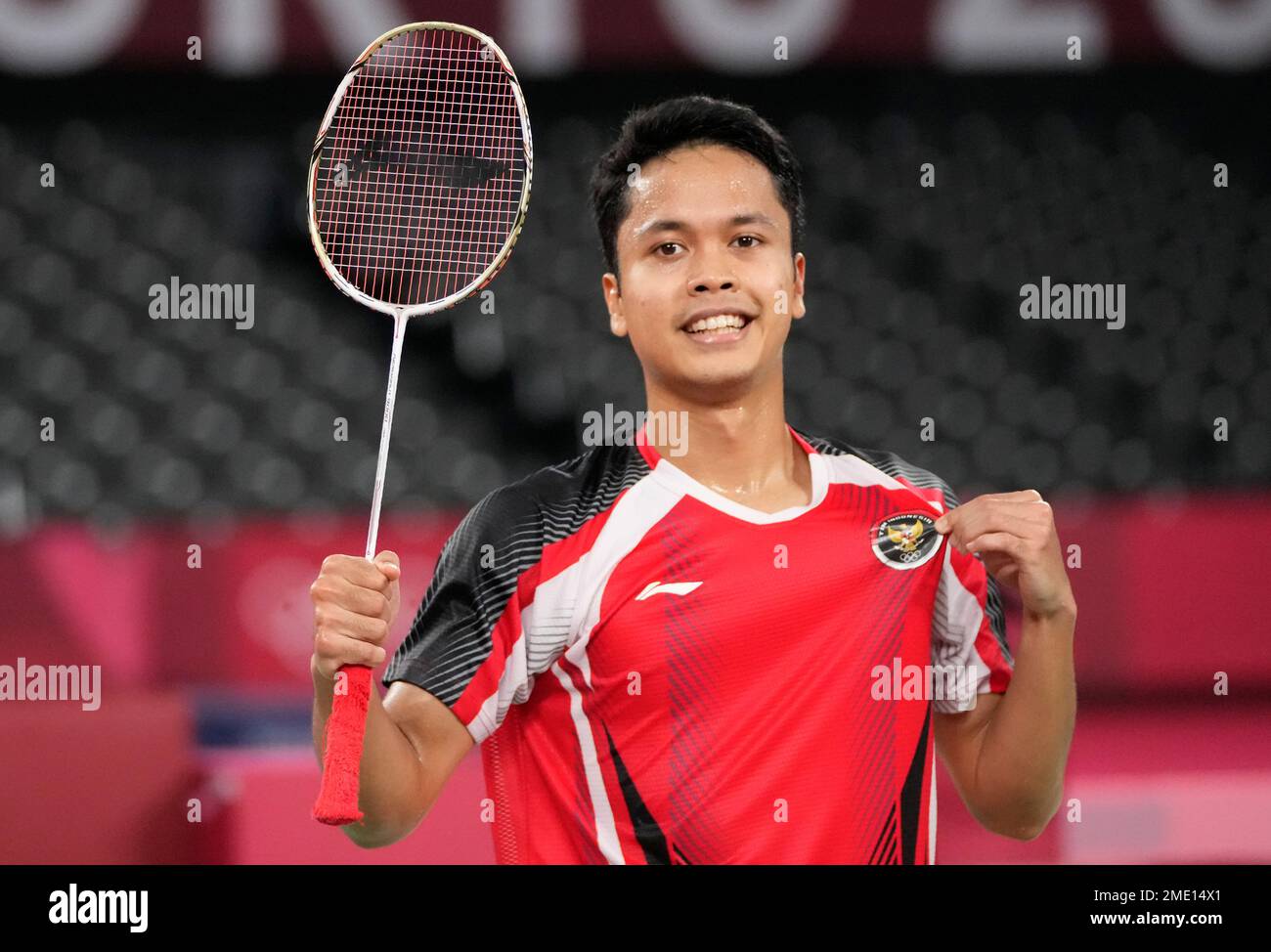Indonesia's Anthony Sinisuka Ginting celebrates after winning against ...