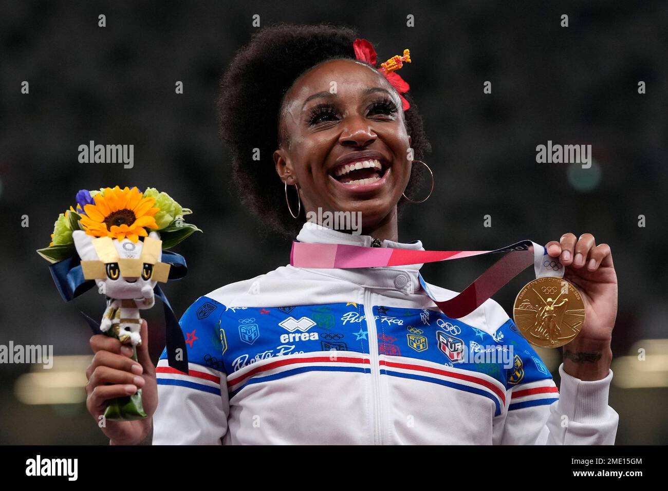 Jasmine CamachoQuinn, of Puerto Rico, poses with her gold medal after