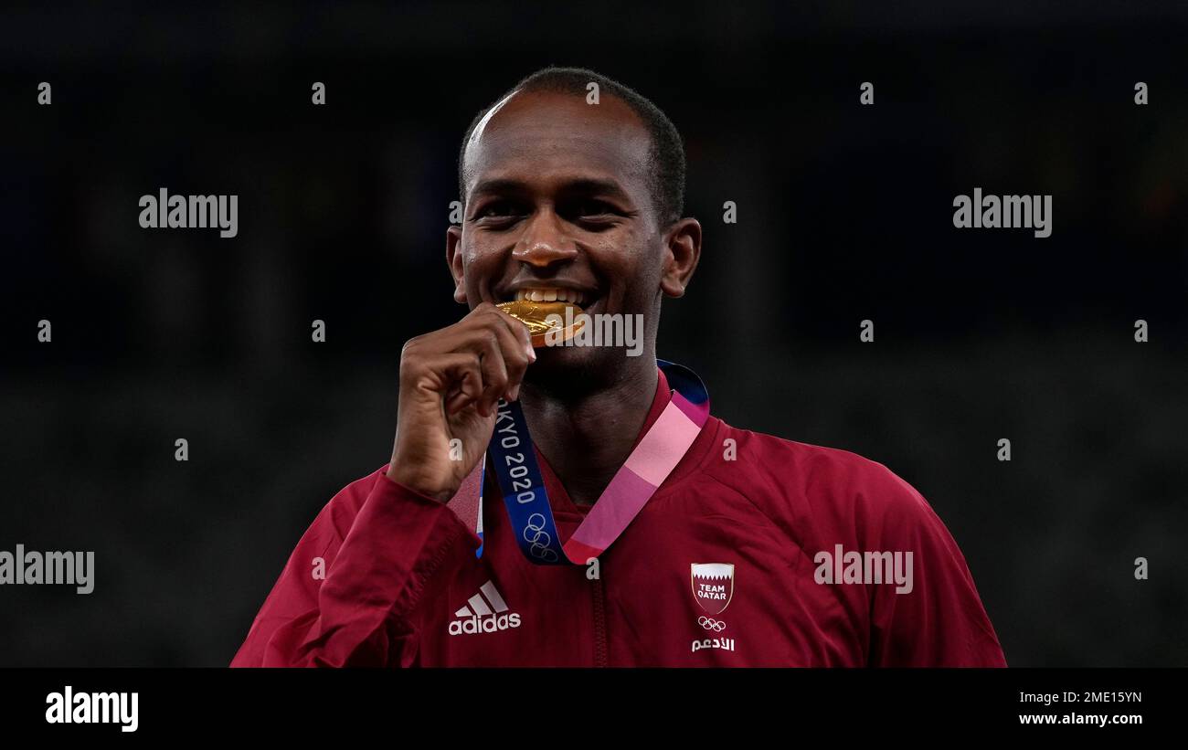 Gold medalist Mutaz Barshim, of Qatar celebrates on the podium ...