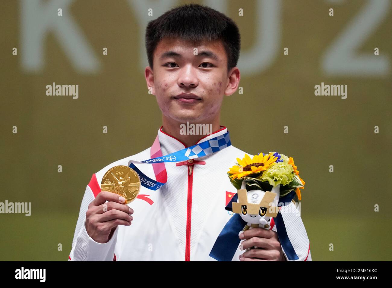 Gold medalist Zhang Changhong, of China, celebrates after the men’s 50