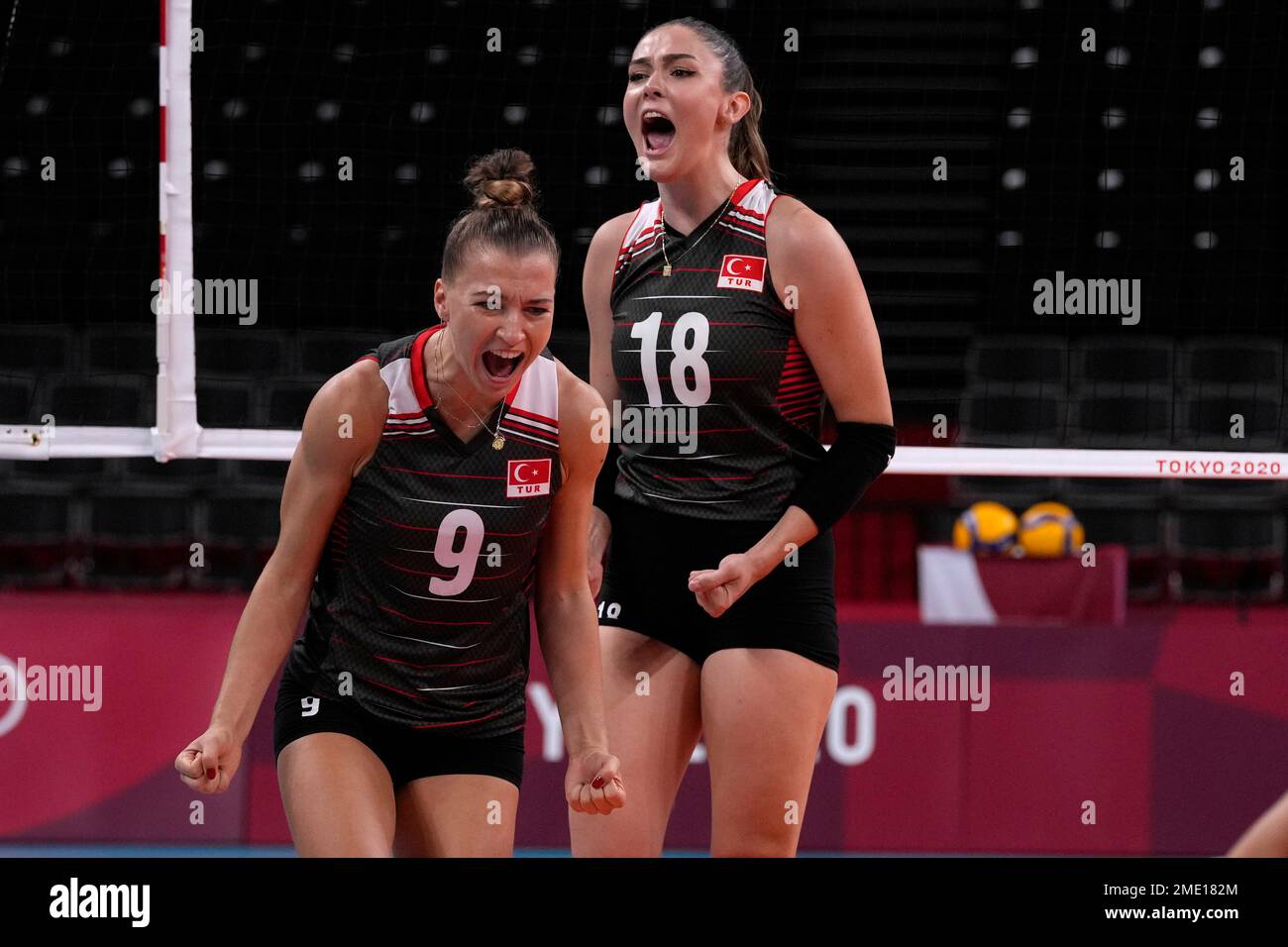 Turkeys Meliha Ismailoglu, left, and Turkeys Zehra Gunes celebrate winning a point during the womens volleyball preliminary round pool B match between Russian Olympic Committee and Turkey at the 2020 Summer Olympics,