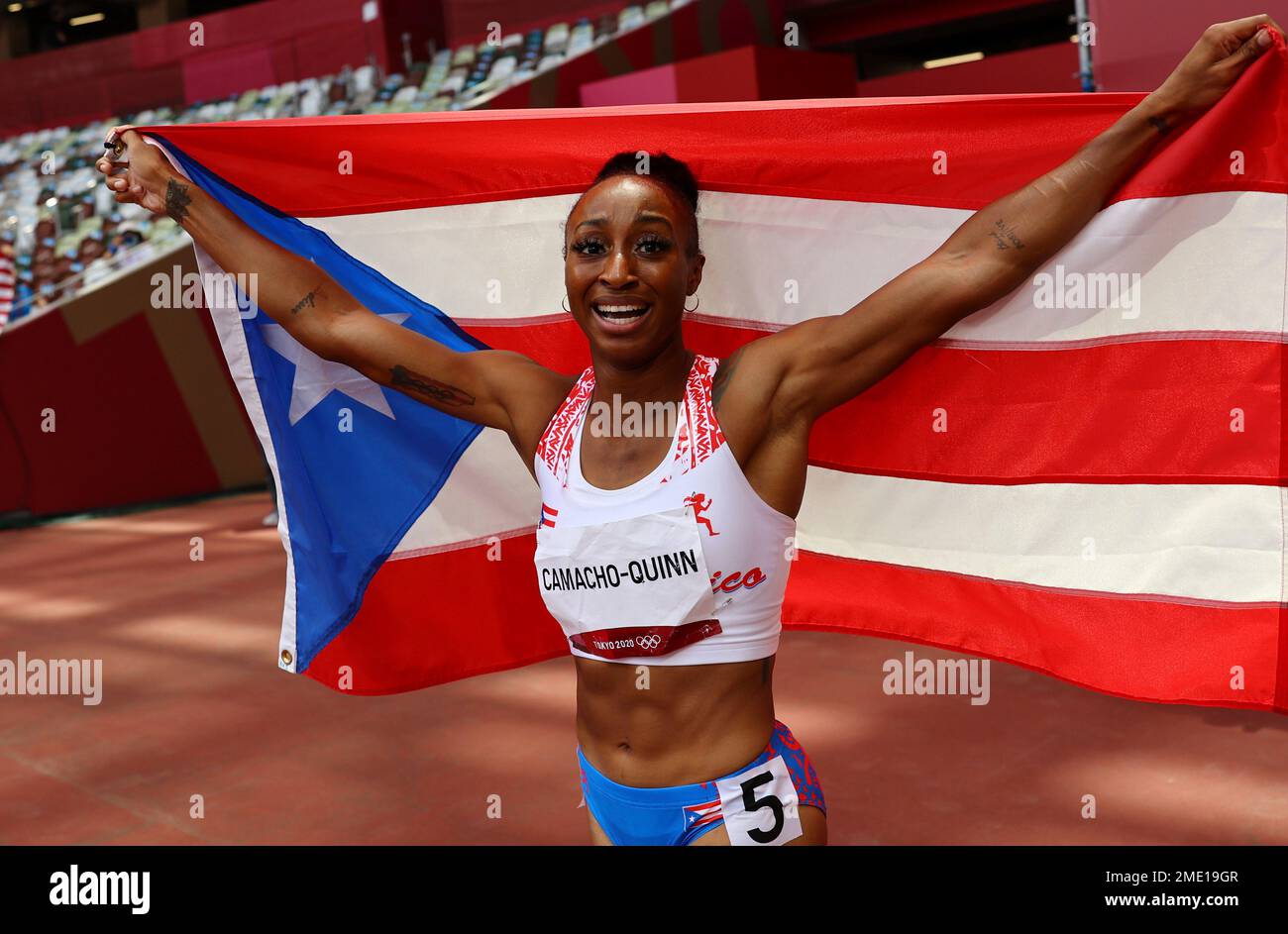 Jasmine CamachoQuinn, of Puerto Rico celebrates after winning the gold