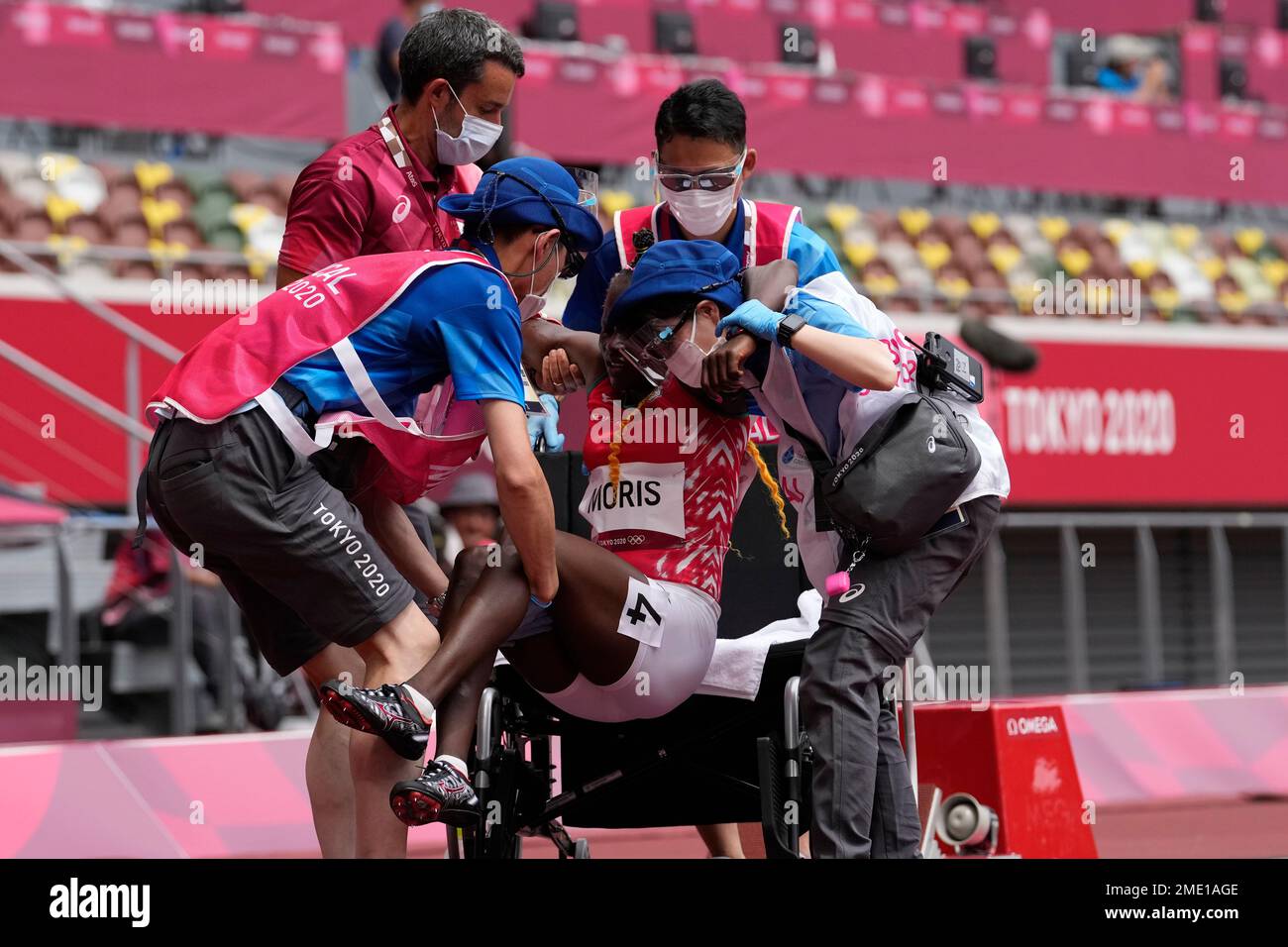 Lucia Moris, of South Sudan, is placed into a wheelchair after she