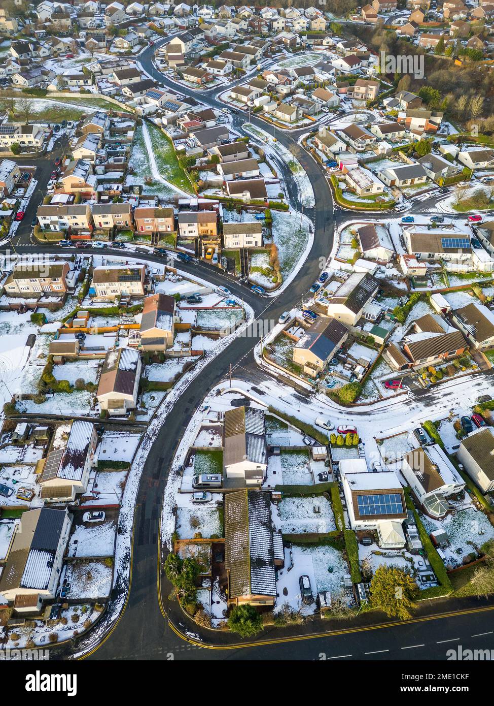 Aerial view of a snow covered urban scene of roads and house (South Wales) Stock Photo