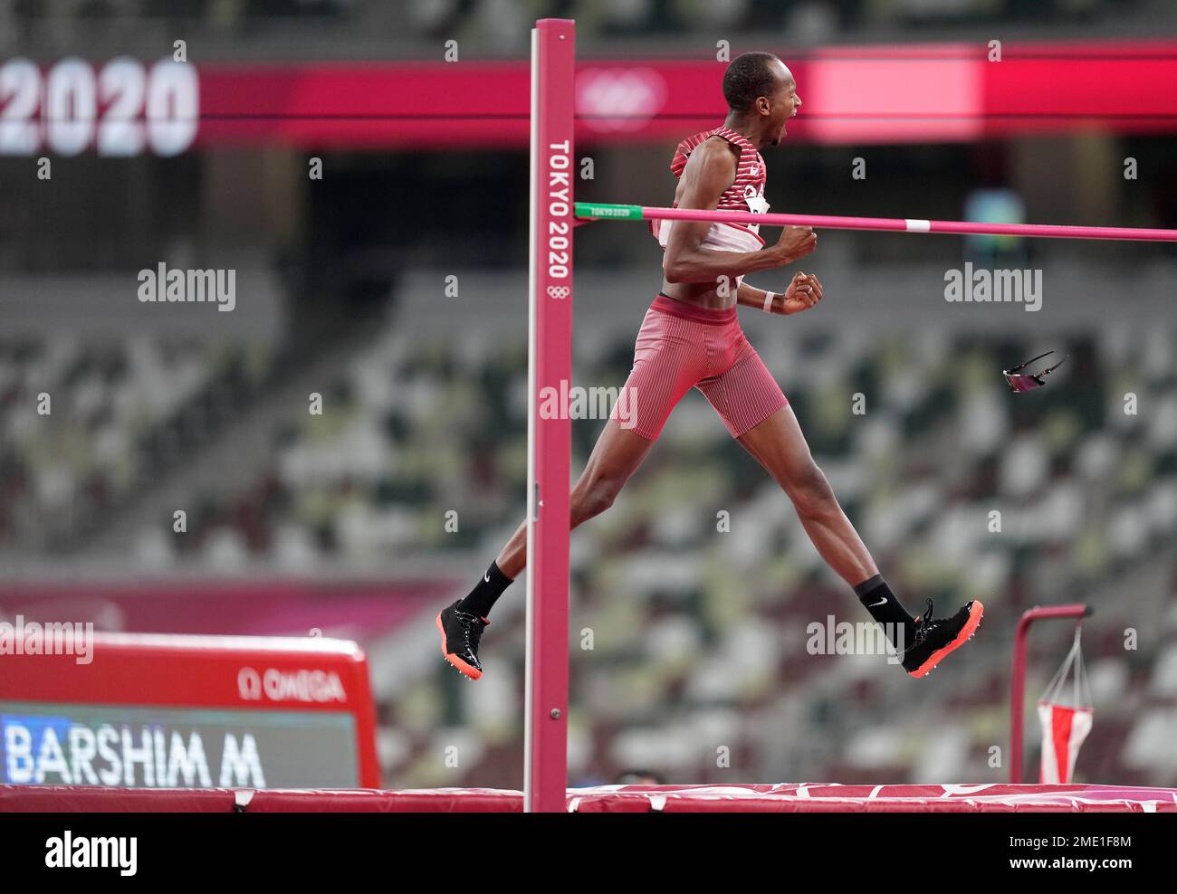 Mutaz Barshim, of Qatar, reacts after making a clearance during the ...