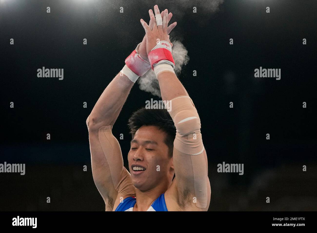 Lee Chihkai of Taiwan, celebrates after performing on the pommel horse