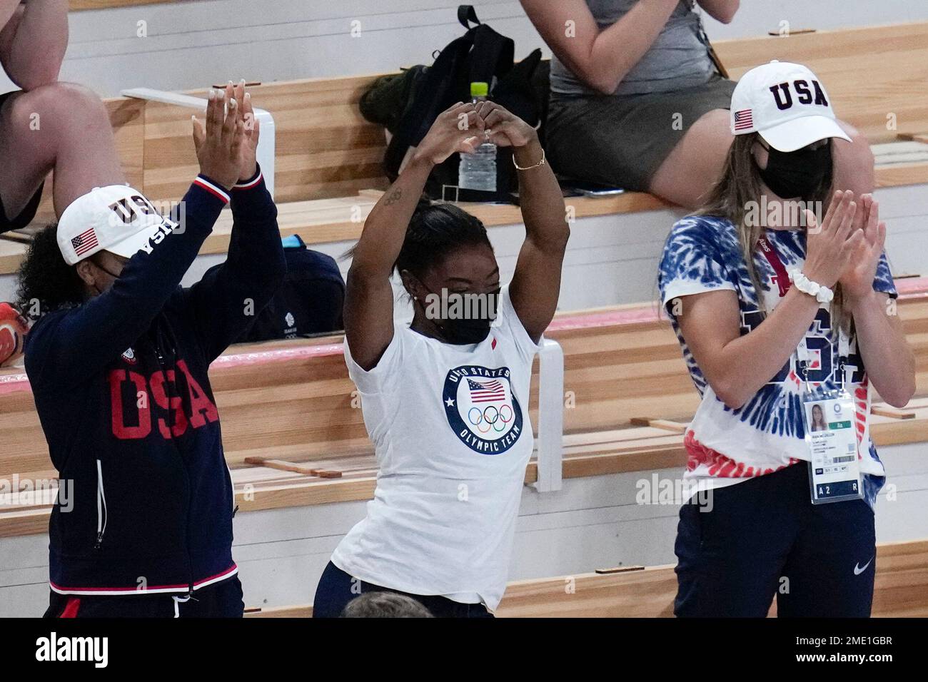 Simone Biles of the United States, center, celebrates after teammate