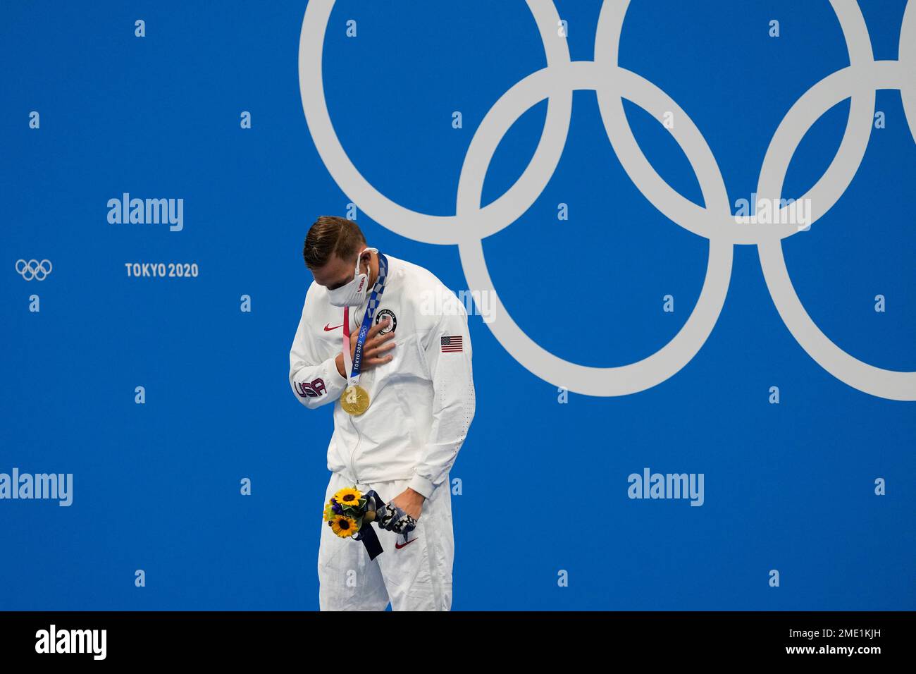 Caeleb Dressel, of the United States, celebrates his gold medal in the ...