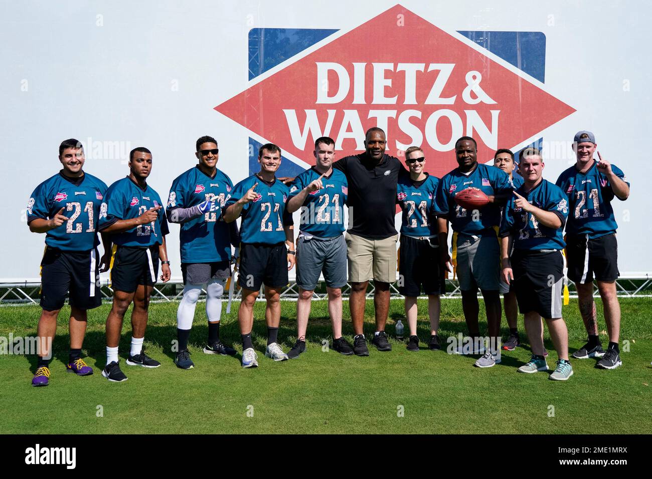Philadelphia Eagles Alum William Thomas, center, poses with his team of  members of the US military after playing a game of flag football on the  field for the 'Back Together Saturday' during