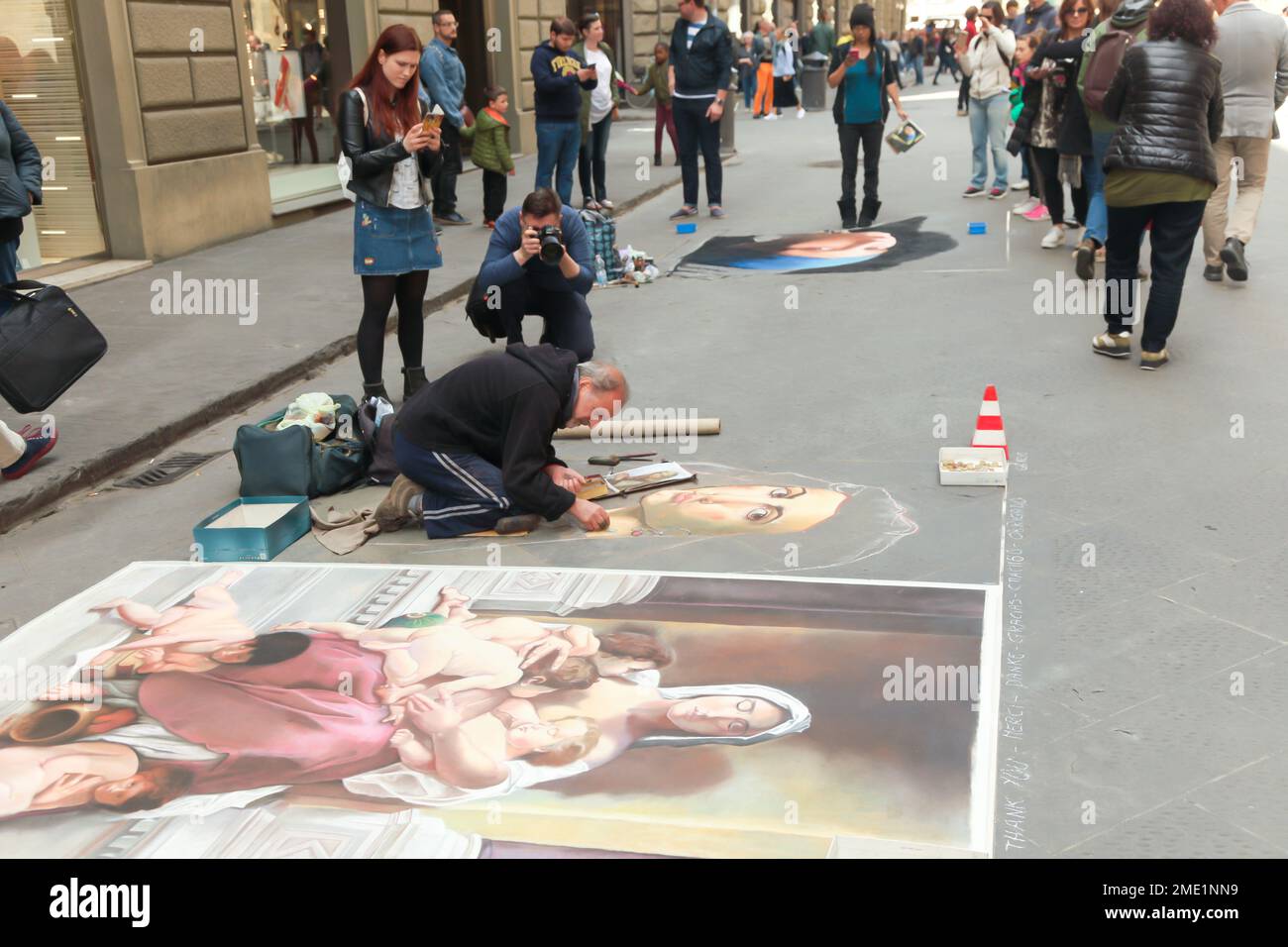 Italy, Florence, a painter makes a portrait in the streets of florence