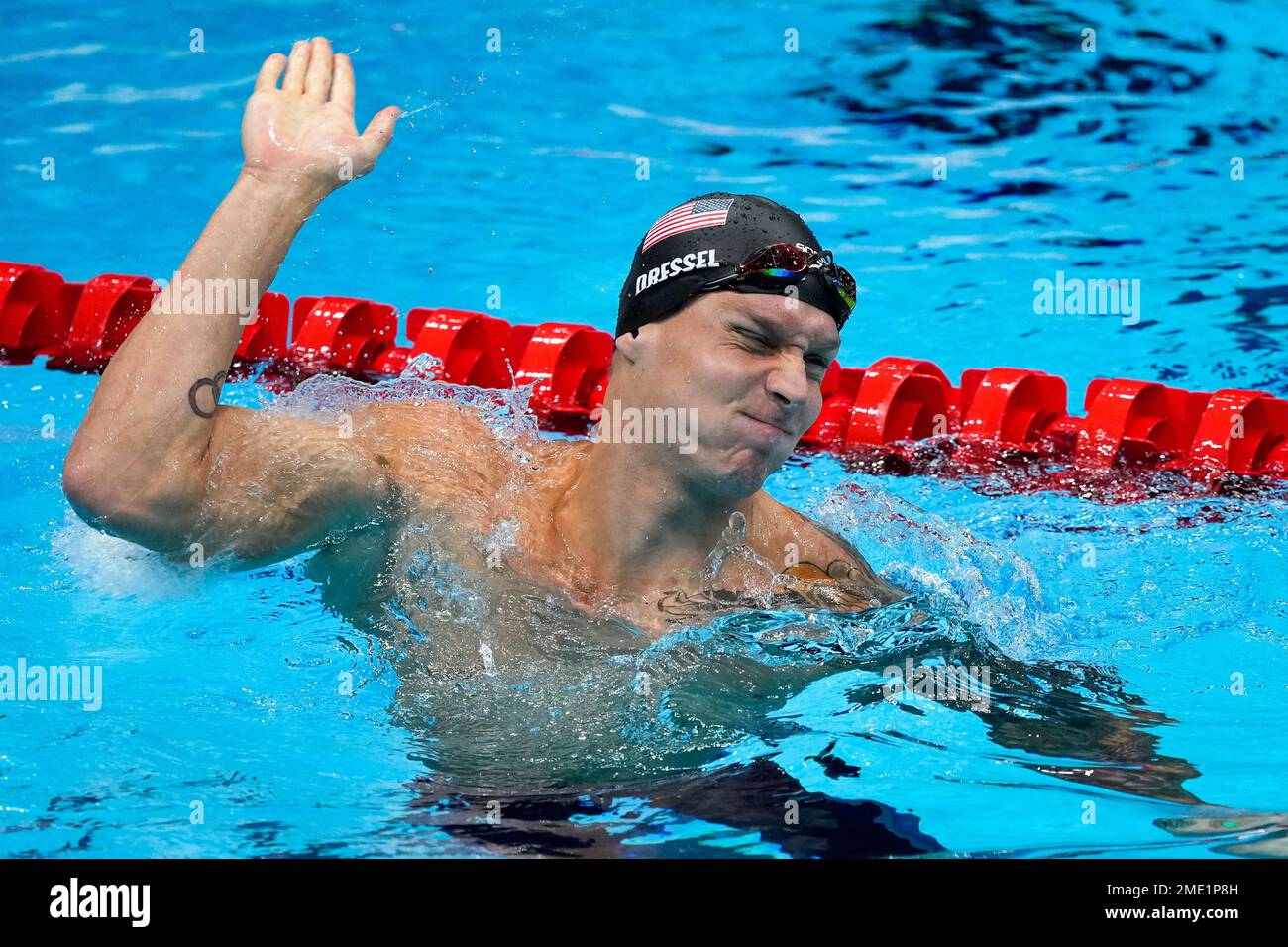 Caeleb Dressel, of United States, celebrates winning the gold medal the ...