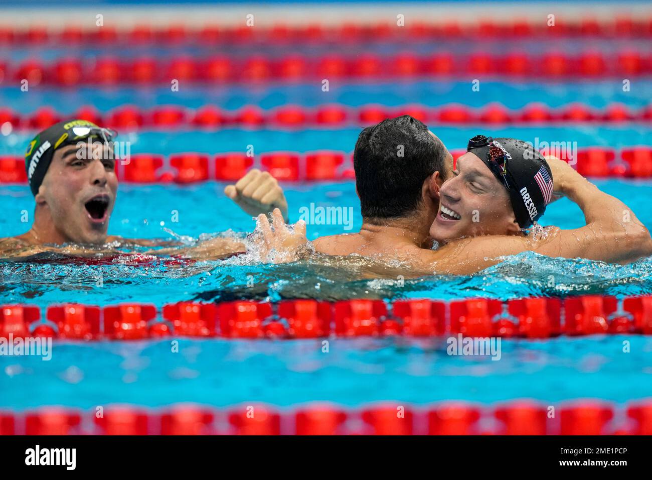 Caeleb Dressel, of United States, celebrates after winning the gold ...
