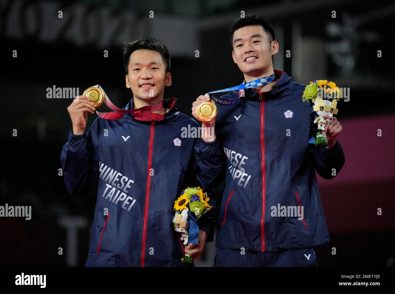 Gold medalists Taiwan's Wang Chi-Lin and Lee Yang, left, celebrate ...