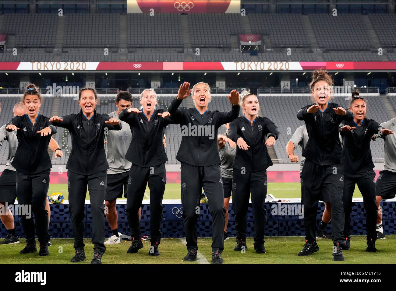 New Zealand players and team staff perform the haka after winning gold