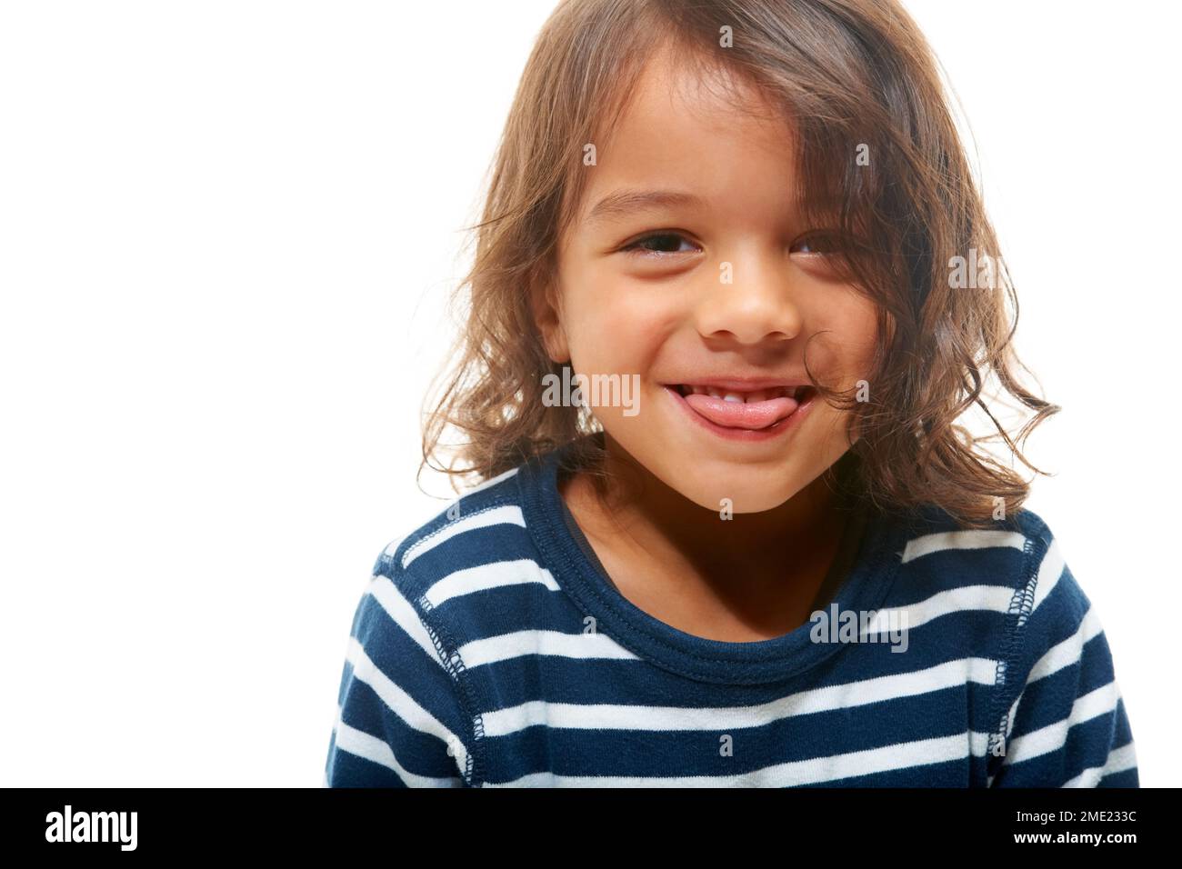 Portrait, children and tongue with a boy in studio isolated on a white background for mockup or branding. Kids, face and silly with a male child on Stock Photo