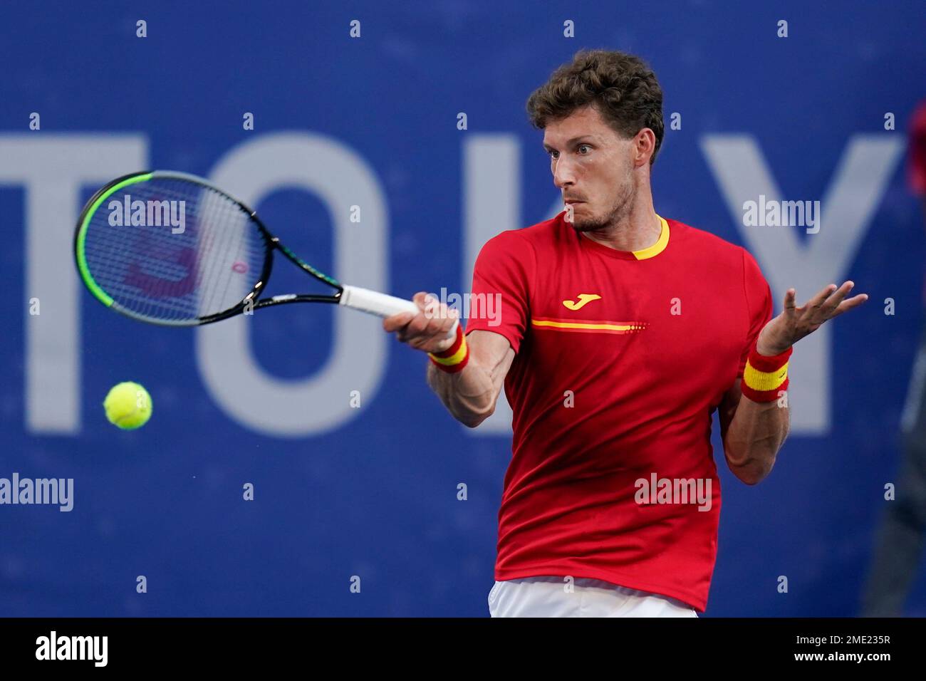 Pablo Carreno Busta, of Spain, returns a shot to Novak Djokovic, of Serbia, during the bronze medal match of the tennis competition at the 2020 Summer Olympics, Saturday, July 31, 2021, in