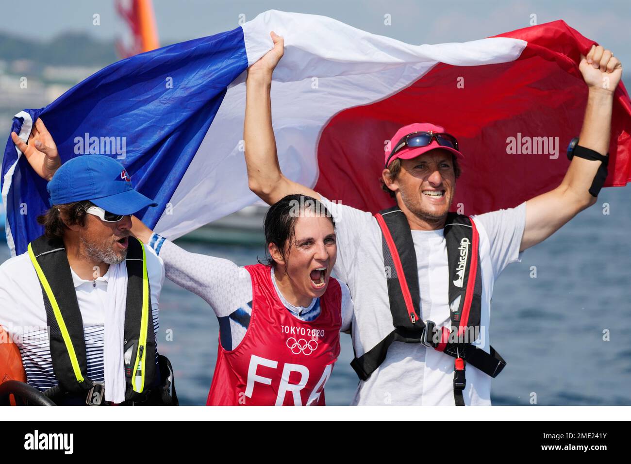 France's Charline Picon, center, celebrates after placing second in the ...