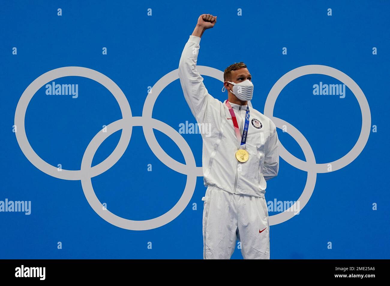 Caeleb Dressel, of the United States, reacts after winning the gold ...