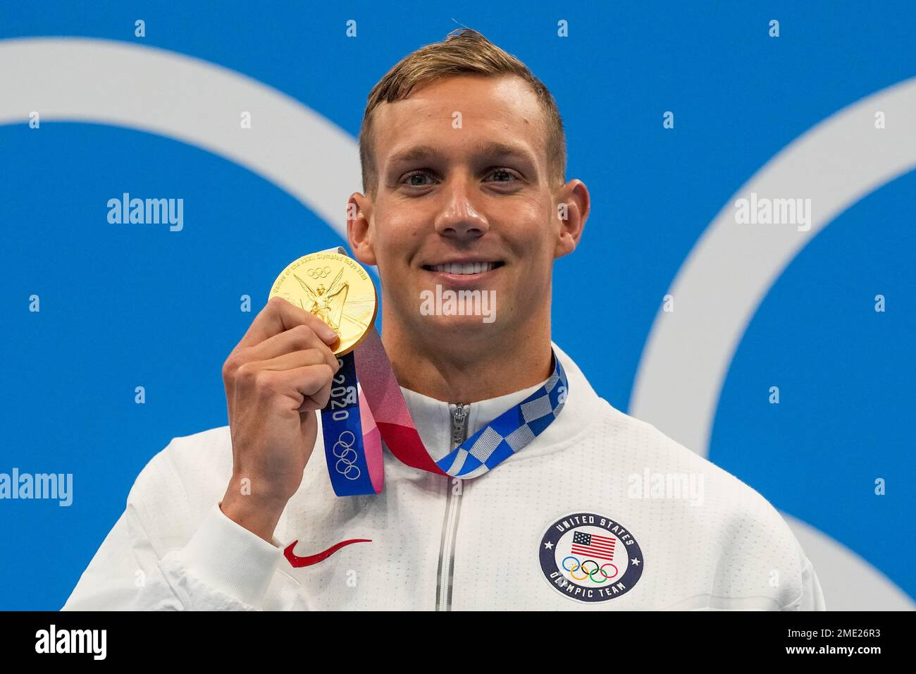 Caeleb Dressel, of United States, poses after winning the gold medal in ...