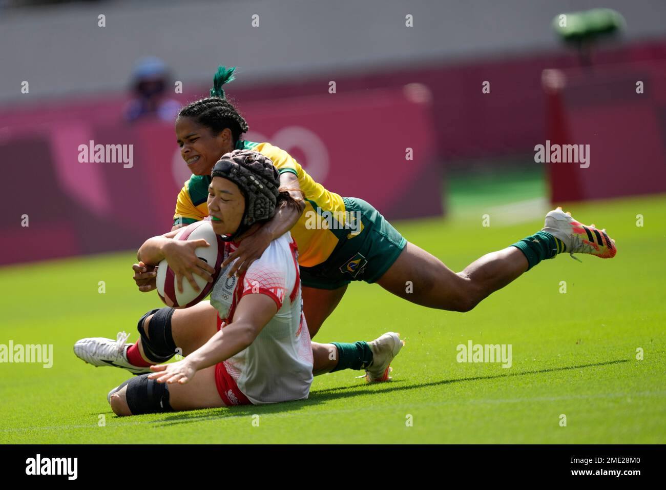 Japan's Haruka Hirotsu is tackled by Brazil's Thalia da Silva Costa as ...