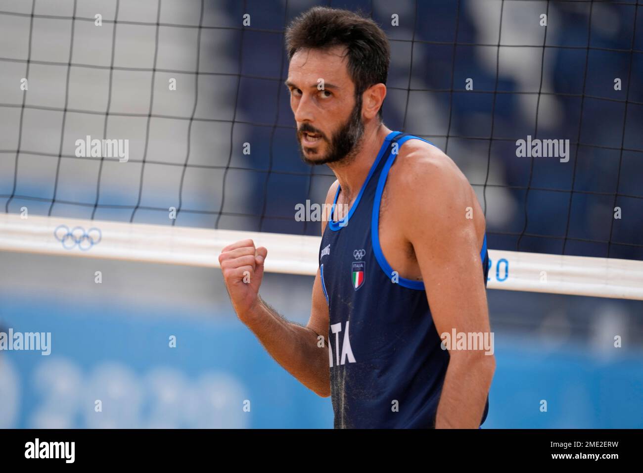 Paolo Nicolai, of Italy, celebrates a play during a men's beach volleyball  match against Poland at the 2020 Summer Olympics, Friday, July 30, 2021, in  Tokyo, Japan. (AP Photo/Petros Giannakouris Stock Photo - Alamy