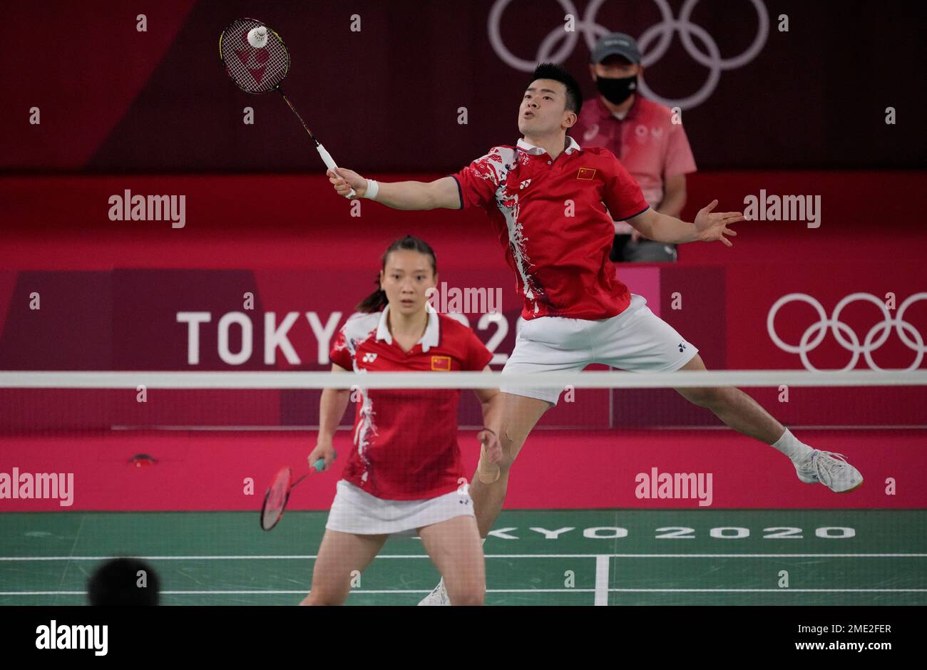 Chinas Zheng Si Wei and Huang Ya Qiong play against compatriot Wang Li Lyu and Huang Dong Ping during their mixed doubles badminton final match at the 2020 Summer Olympics, Friday, July