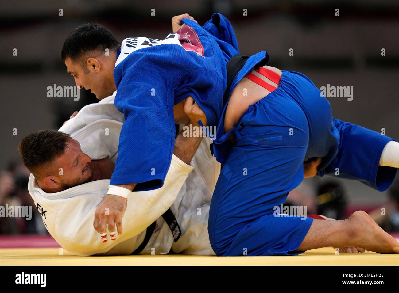 Javad Mahjoub of the Refugee Olympic Team, top, and Lukas Krpalek of the  Czech Republic compete during their men's +100kg elimination round judo  match at the 2020 Summer Olympics, Friday, July 30,