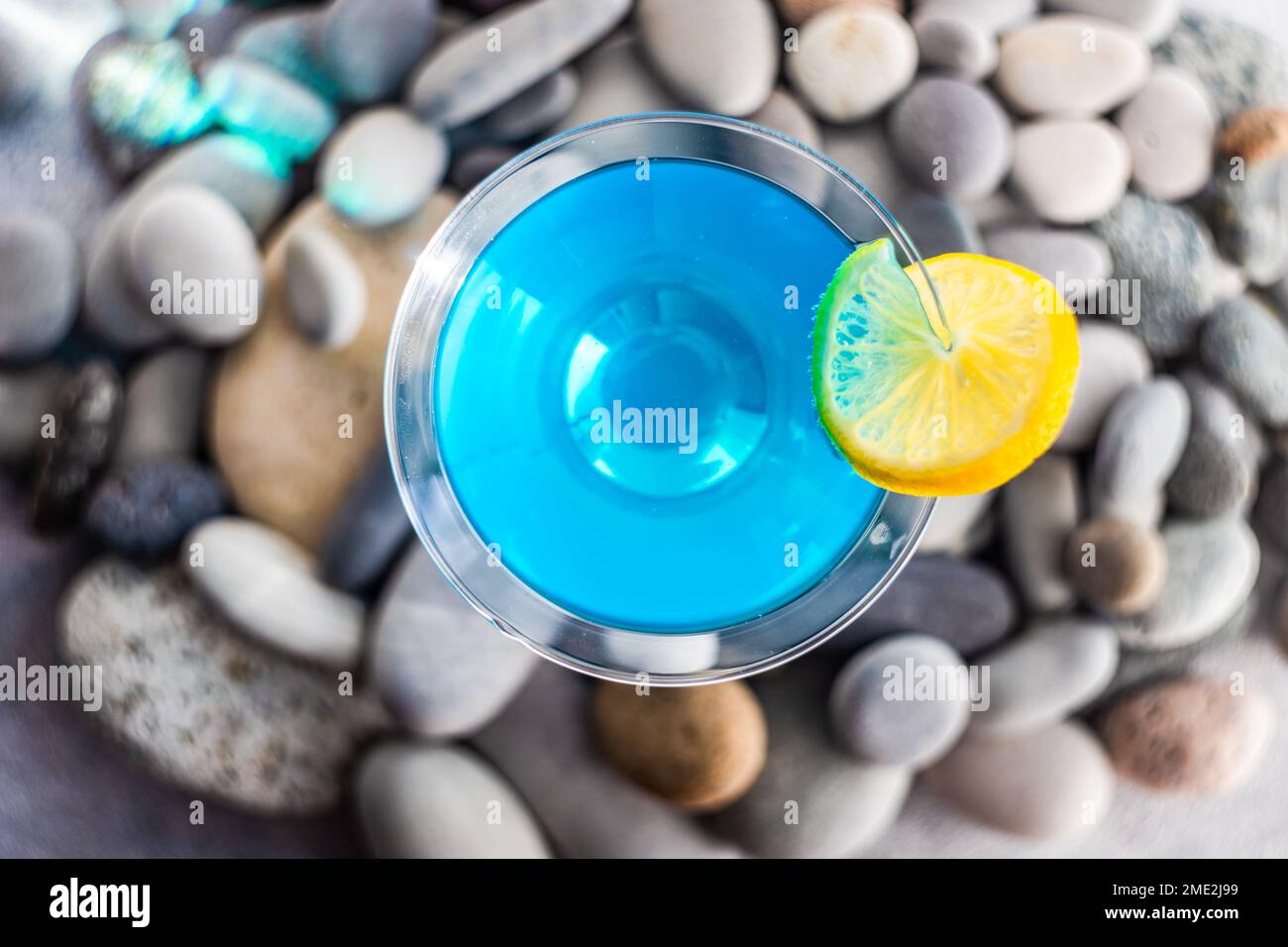 Glass of blue kamikaze drink on stones in modern style Stock Photo - Alamy