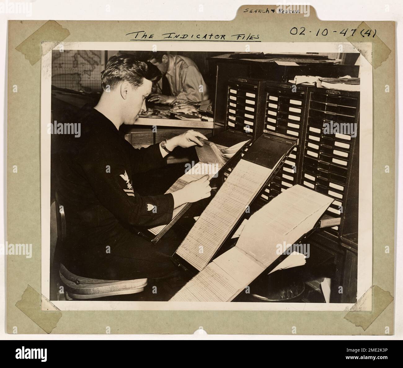 The Indicator Files. This image depicts A Coast Guardsman checking the