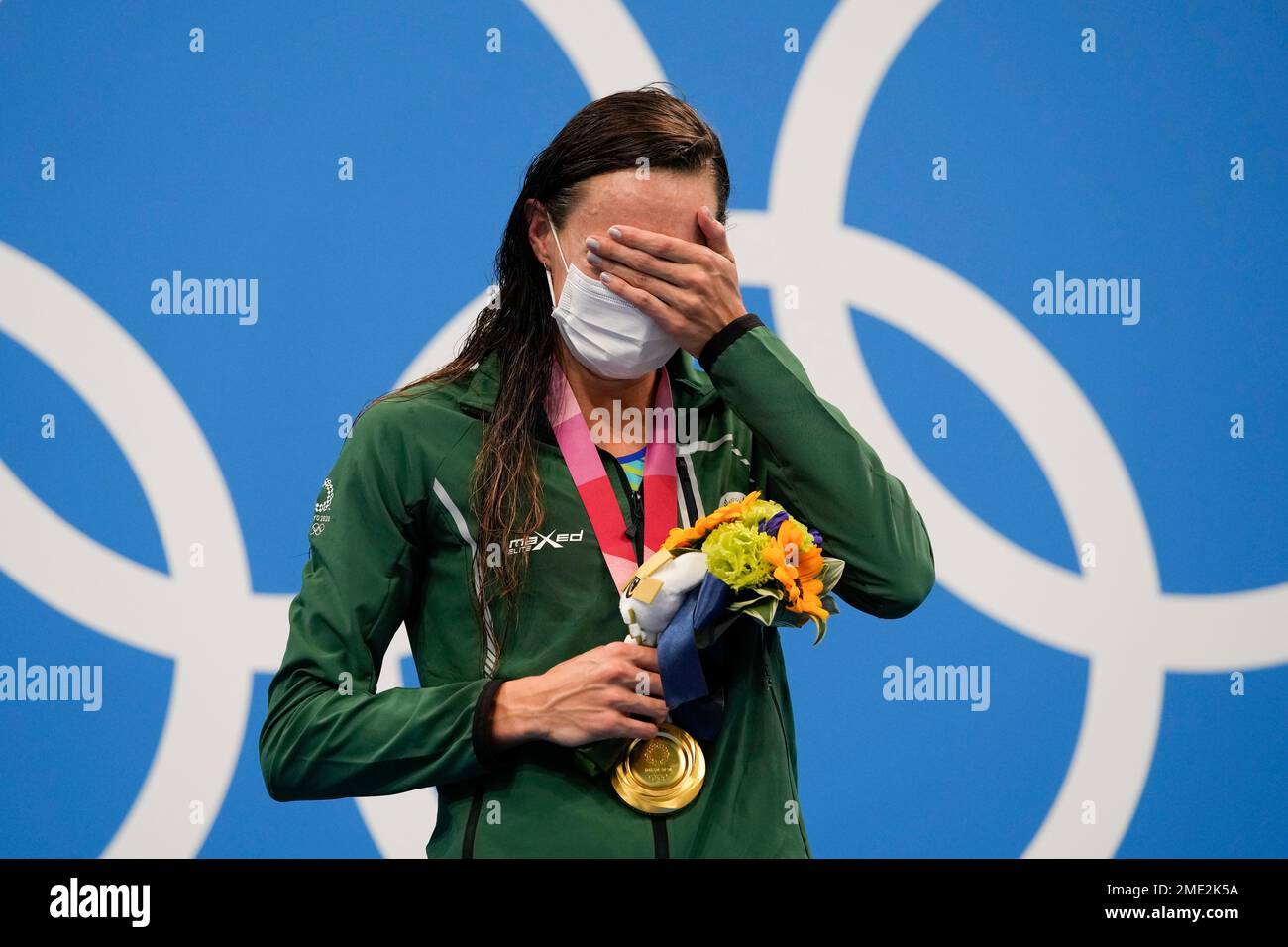 Tatjana Schoenmaker, of South Africa, cries after winning the gold