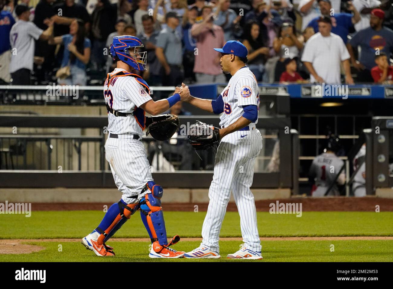 New York Mets pitcher Edwin Diaz, left, and catcher James McCann during