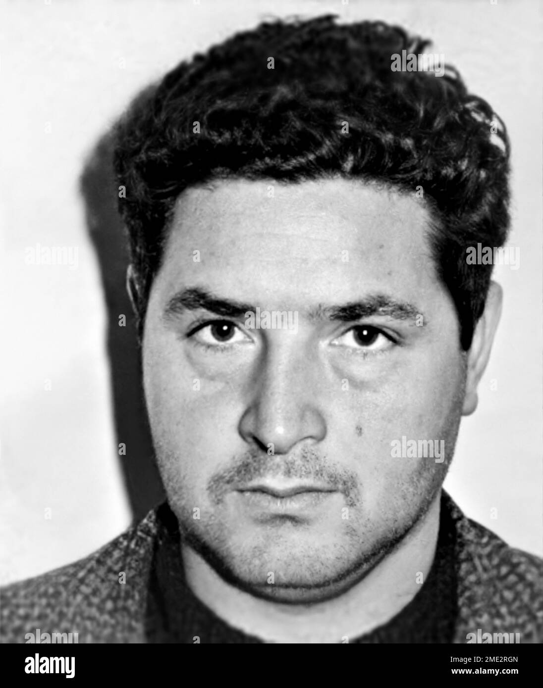 1966 ca, Corleone,  ITALY : The Mafia Boss SALVATORE Totò RIINA ( 1930 - 2017 ), aka U CURTU of Clan dei Corleonesi , italian COSA NOSTRA Mafioso . Was a Sicilian Mafia boss from Corleone ( Palermo ) . Author of hundreds of murders from the 70s to the 90s, as well as being directly responsible for some of the most serious bloodshed of Cosa Nostra . Was married with Antonietta Bagarella , sister of mafioso Leoluca Bagarella ( born 3 february 1942 ). In this image a photoboth mugshot diffused by the italian Police in 1966 ca when Riina was  young . Unknown photographer . DIGITALLY RESTORED . - Stock Photo