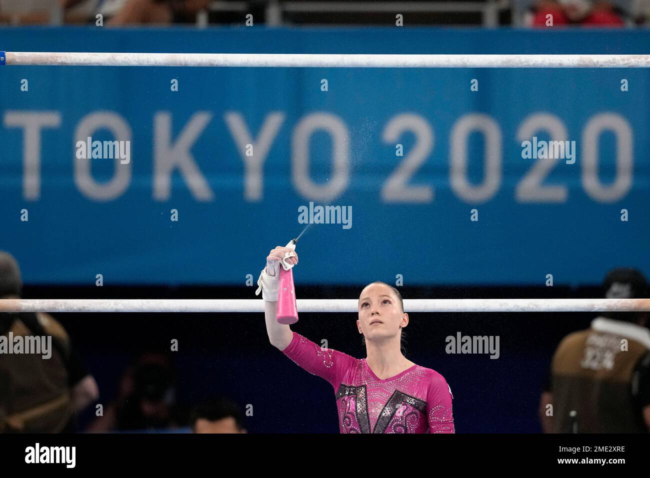 Vladislava Urazova, of the Russian Olympic Committee, sprays the bar