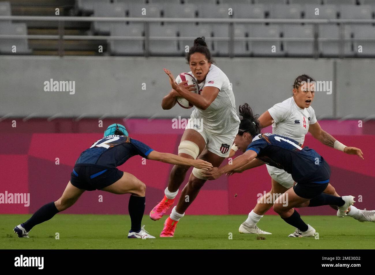 Jordan Matyas of the United States tries to break through Japan's