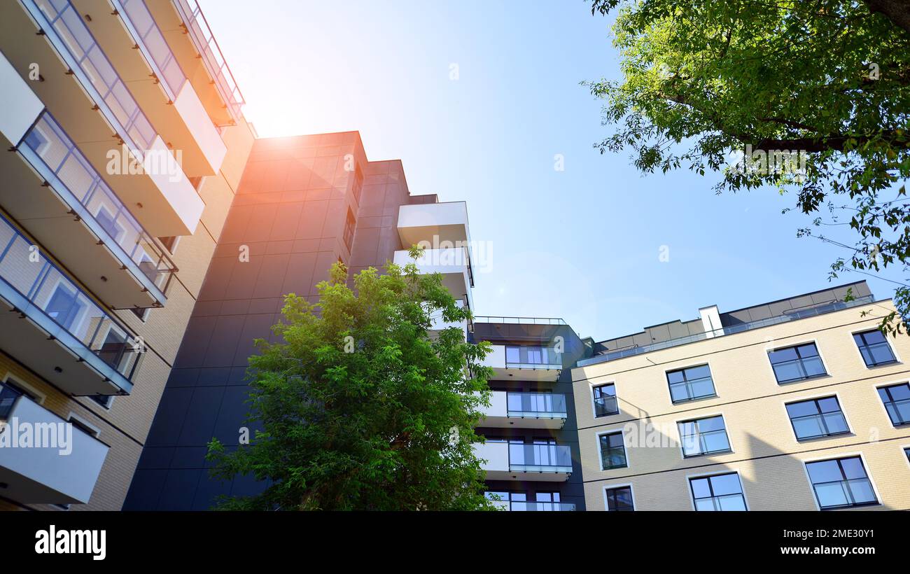 Modern residential building with new apartments in a green residential ... - Green Apartment Home Builders
