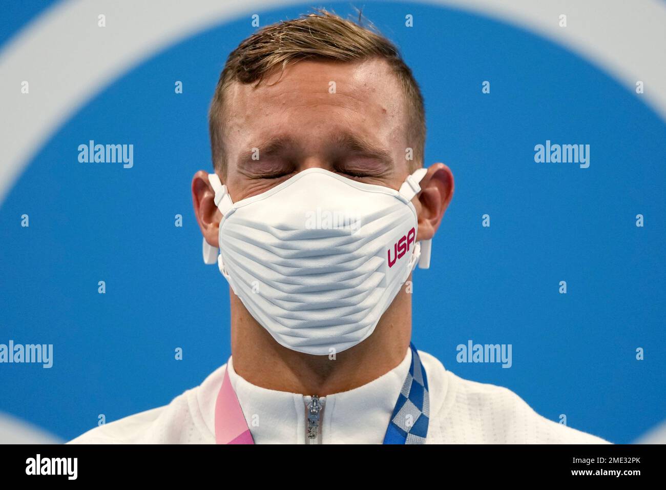 Caeleb Dressel of the United States closes his eyes on the podium after ...