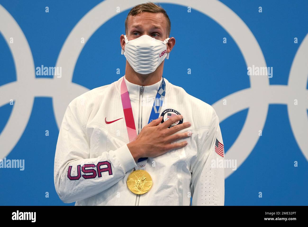Caeleb Dressel of the United States stands on the podium after ...