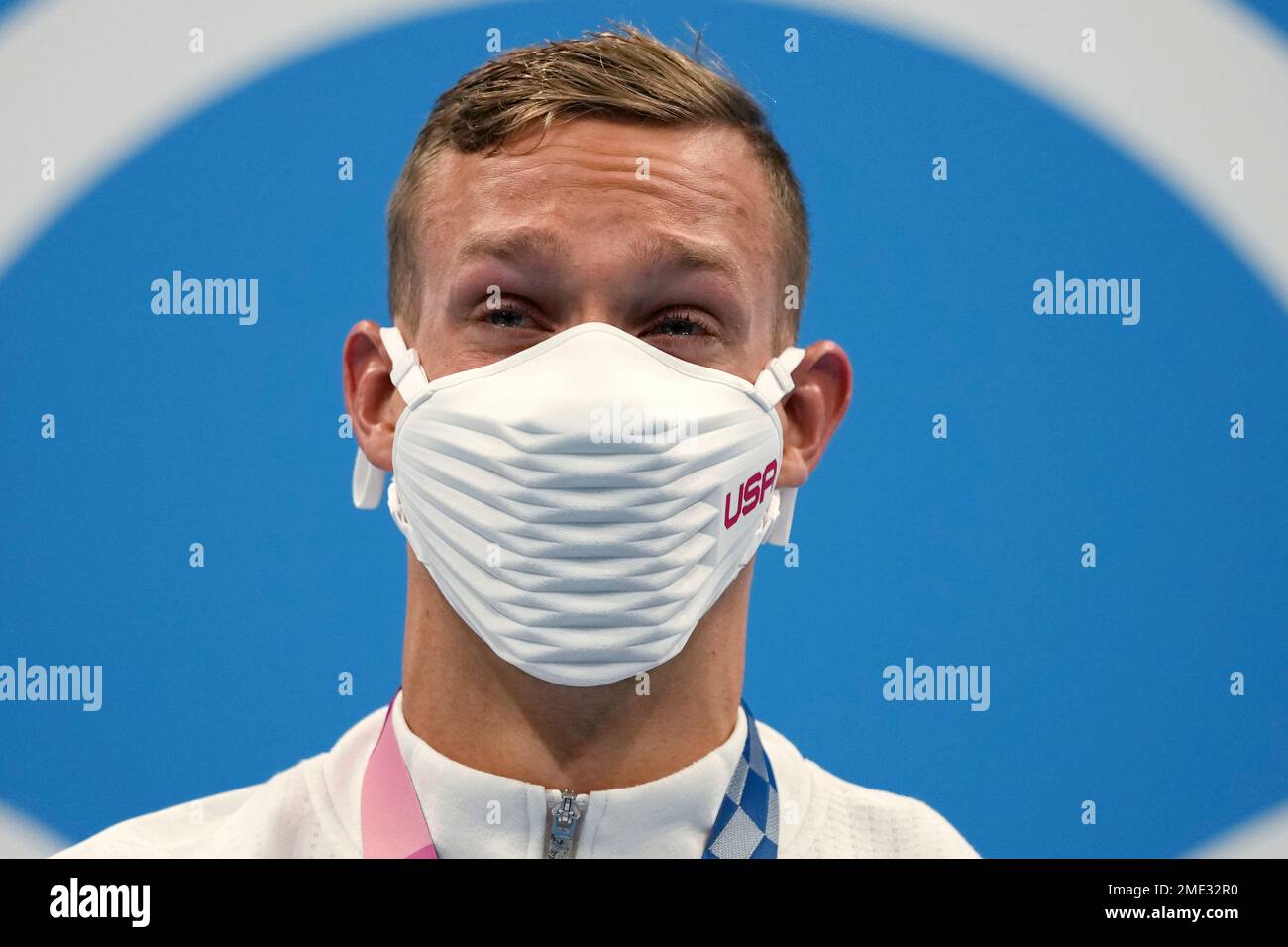 Caeleb Dressel of the United States stands on the podium after ...