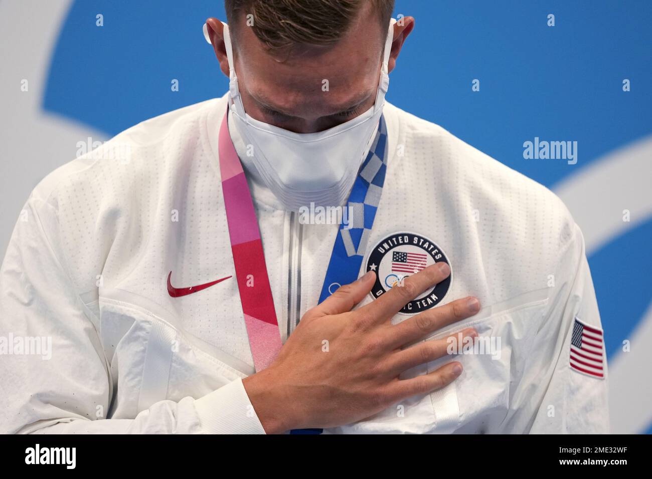 Caeleb Dressel of the United States stands on the podium after ...