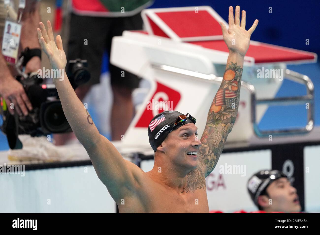 Caeleb Dressel of the United States celebrates winning the men's 100 ...