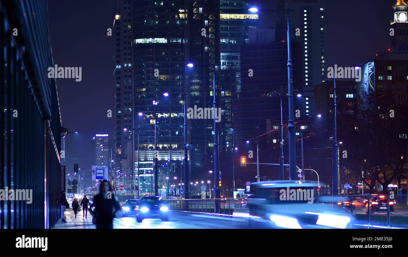 Warsaw, Poland. 23 November 2022. Evening city life in the centre of Warsaw. Cars on street. City street lights at night. Stock Photo