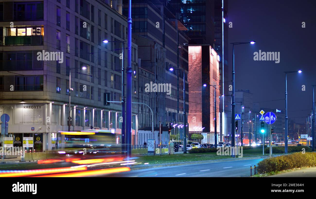 Warsaw, Poland. 23 November 2022. Evening city life in the centre of Warsaw. Cars on street. City street lights at night. Stock Photo