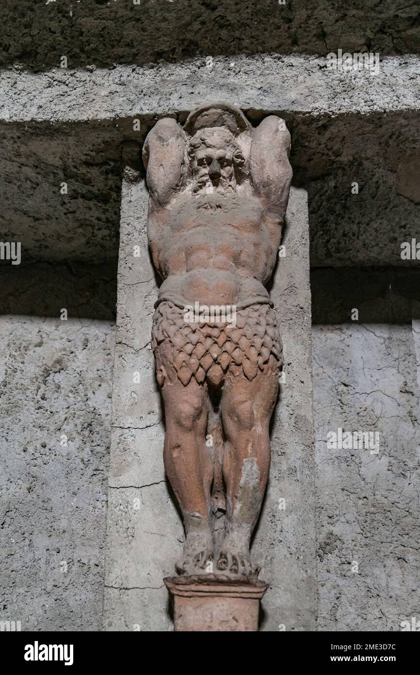 Stone decorative human sculptures excavated in the ancient Roman city of Pompeii, an archaeological UNESCO World Heritage Site in Campania, Italy. Stock Photo