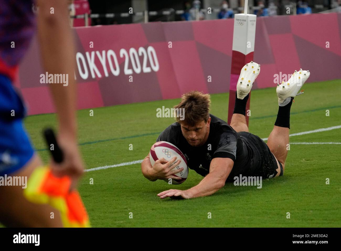 New Zealand's Scott Curry scores a try against Fiji, in the men's rugby sevens gold medal match