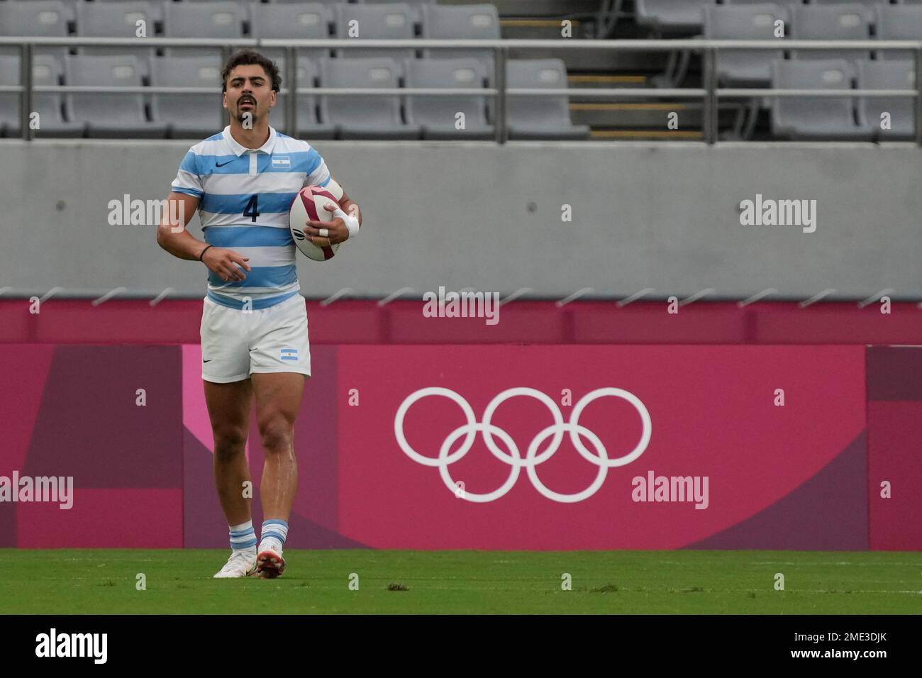 Argentina's Ignacio Mendy walks on the pitch after scoring a try in