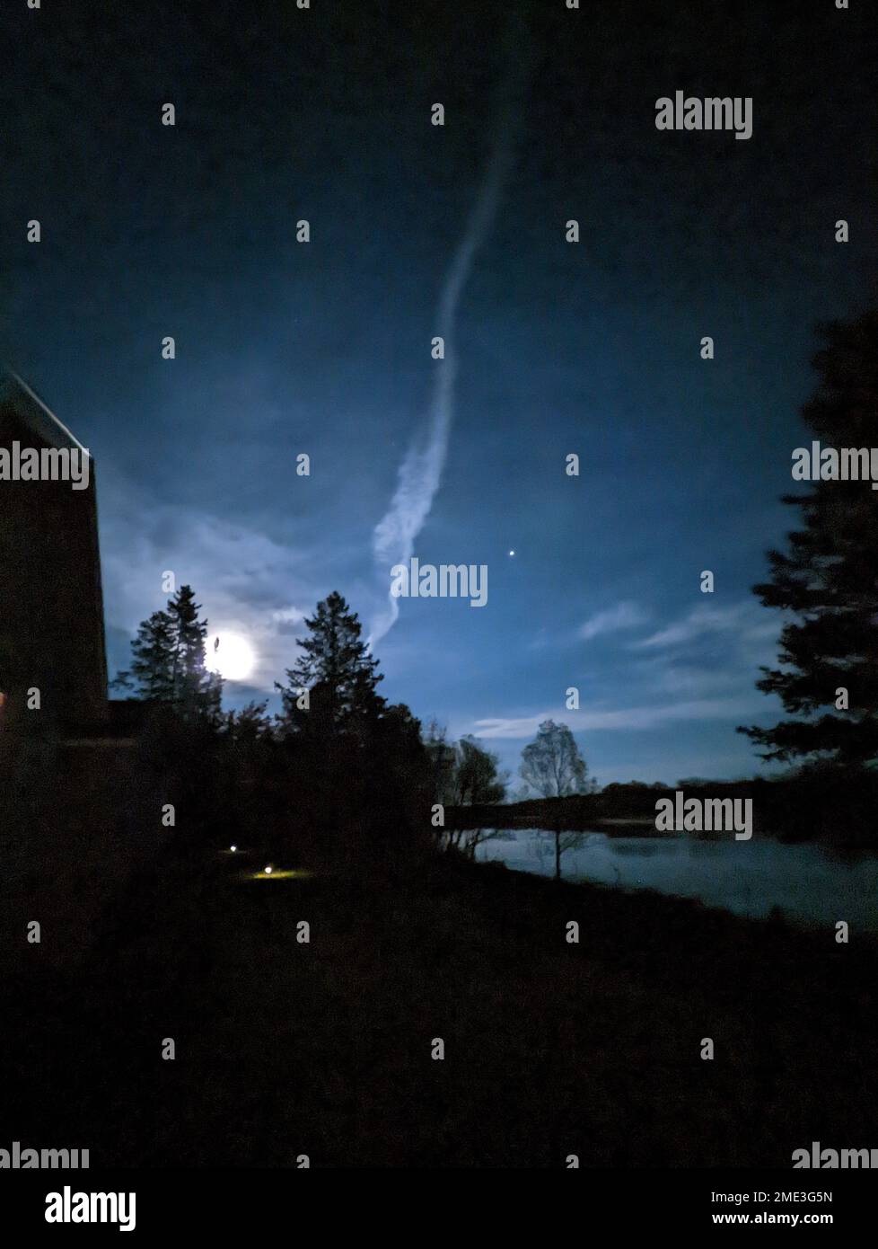 A vertical shot of night sky above the lake Stock Photo - Alamy