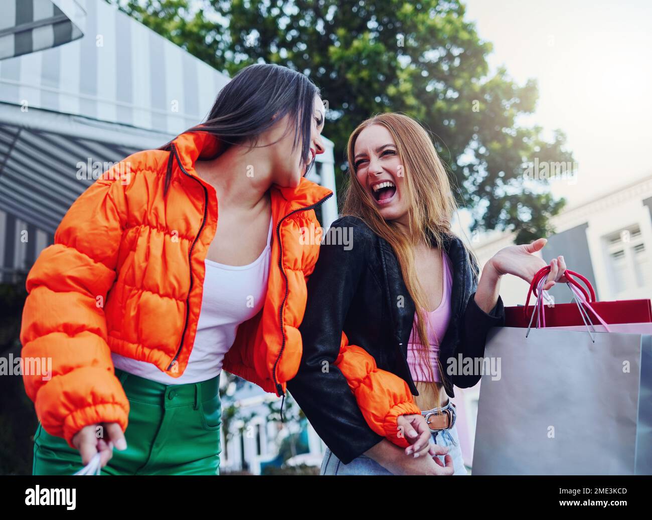 Shopping bag, excited and fashion women in city sale, discount or promotion for gen z lifestyle, customer and retail. Happy people, friends or youth Stock Photo